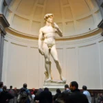 Statue of Michelangelo's David in the Hall of the Colossus at the Uffizi Gallery, Florence.